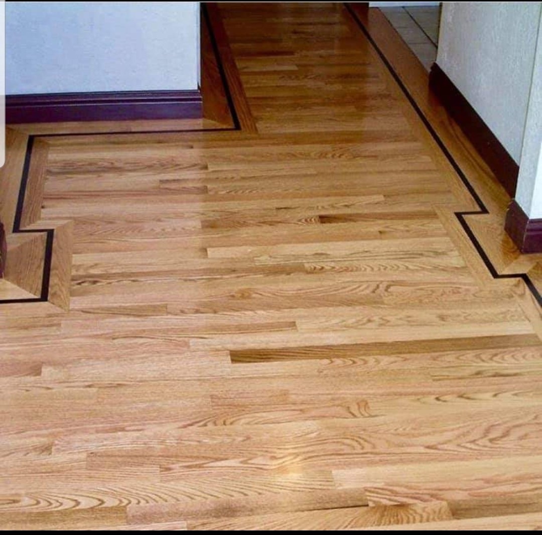Natural wood grain in a hardwood floor with a contrasting dark border